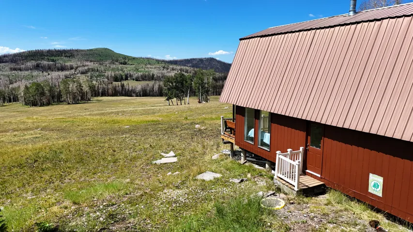 Brown exterior building with a corrugated metal roof