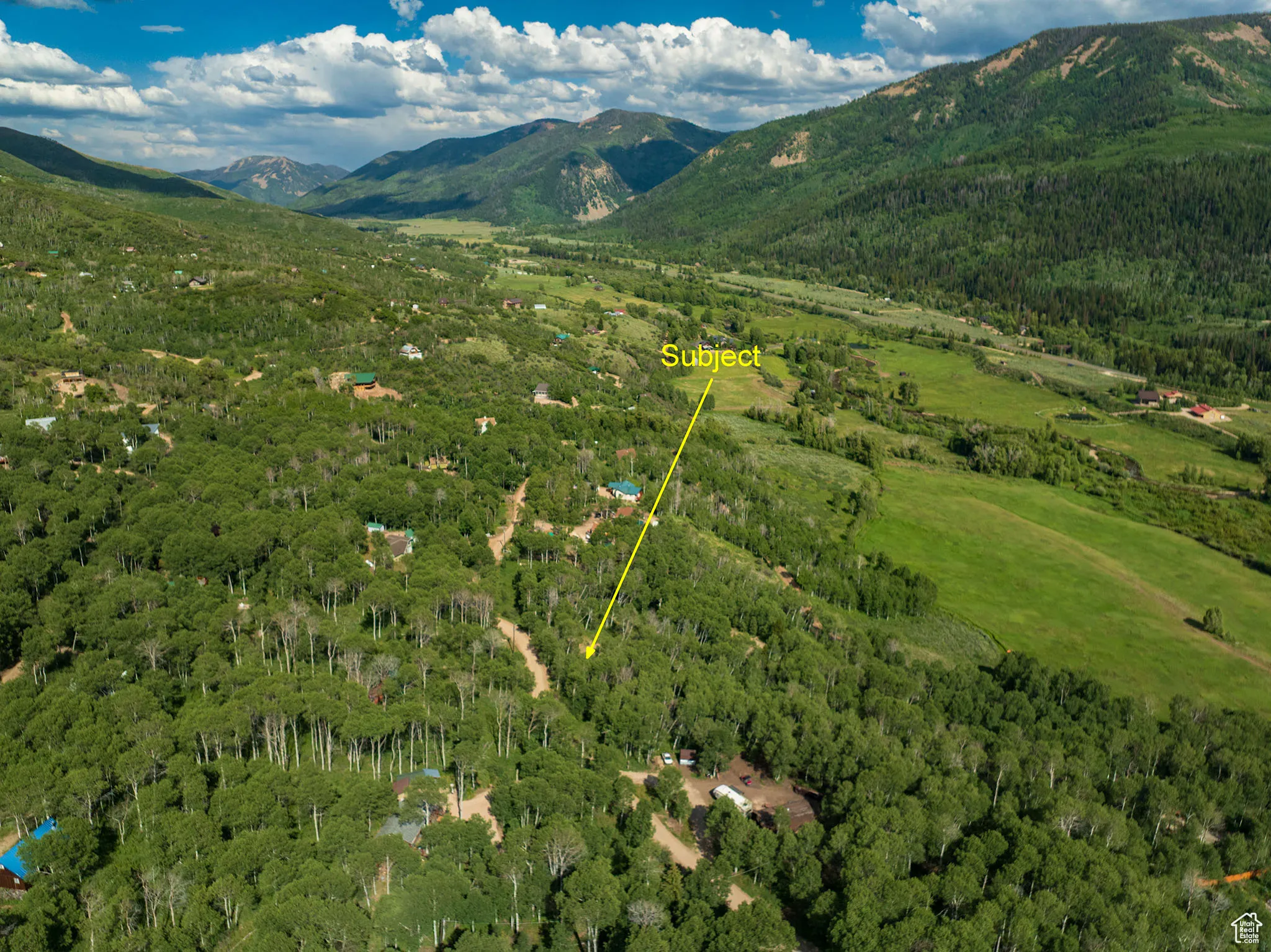 Aerial overview of property's location with mountains
