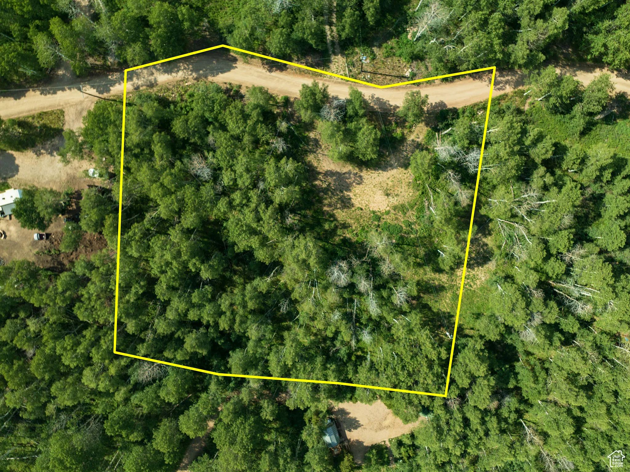 Aerial view of property and surrounding area featuring property parcel outlined