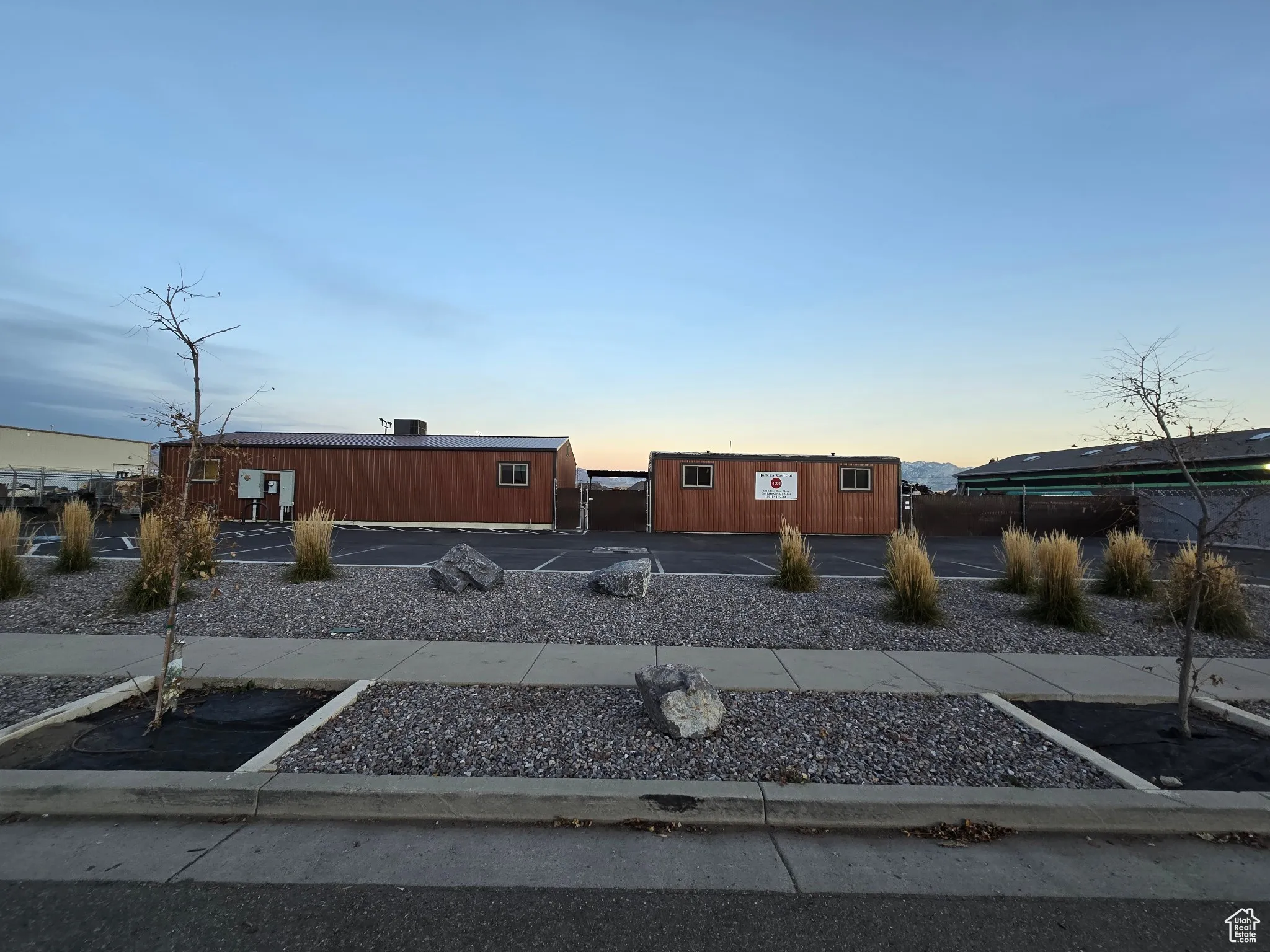 View of property featuring uncovered parking
