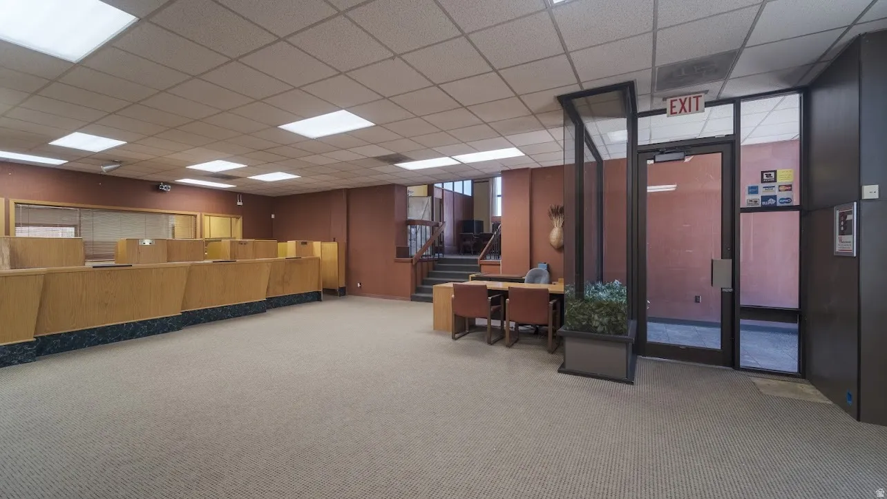 Community lobby with a drop ceiling and stairway
