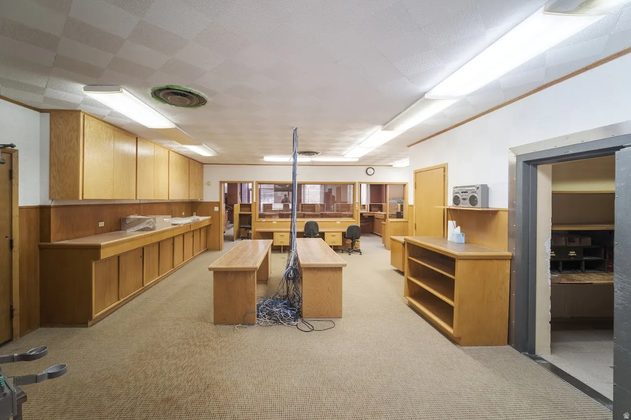 Misc room featuring wooden walls