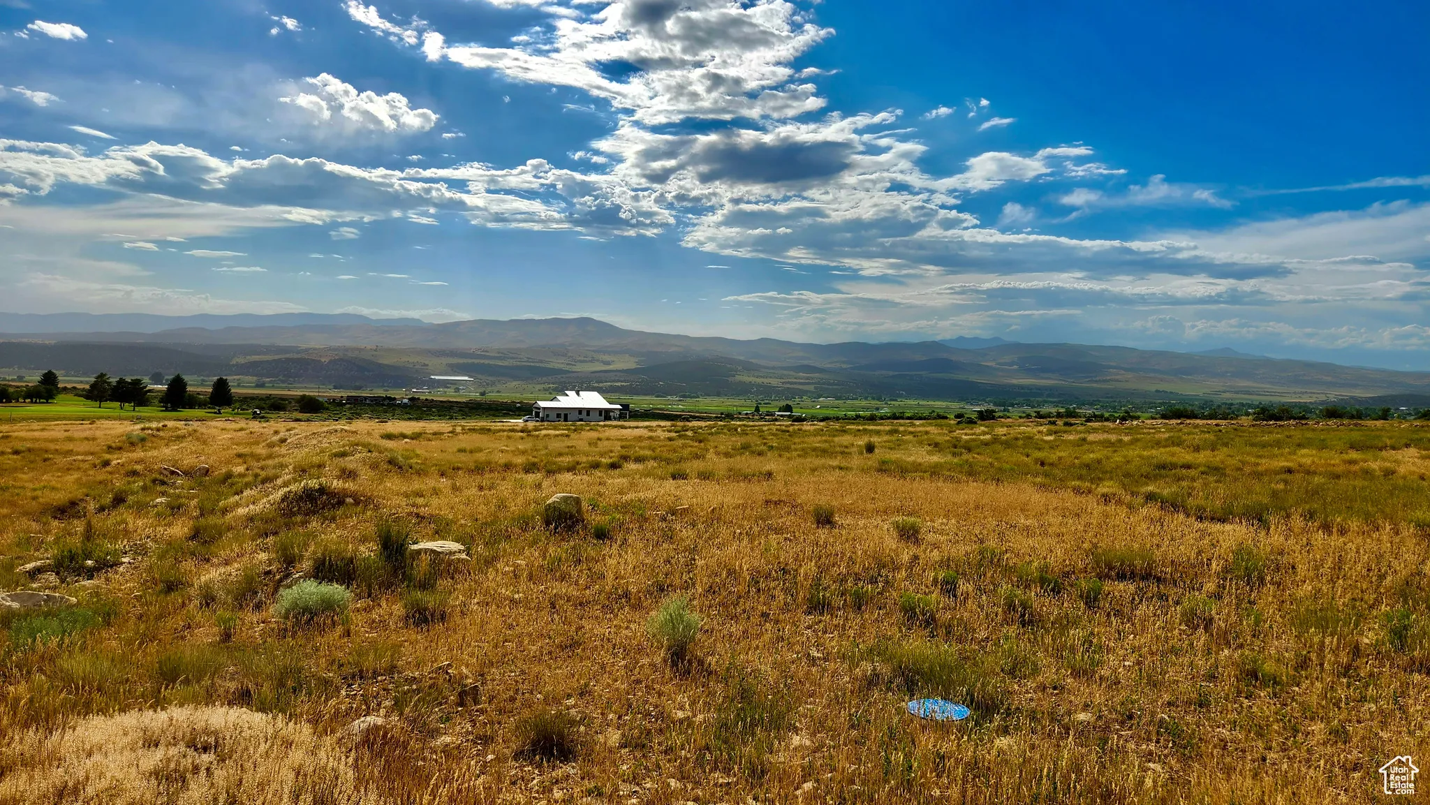 View of mountain background featuring rural landscape