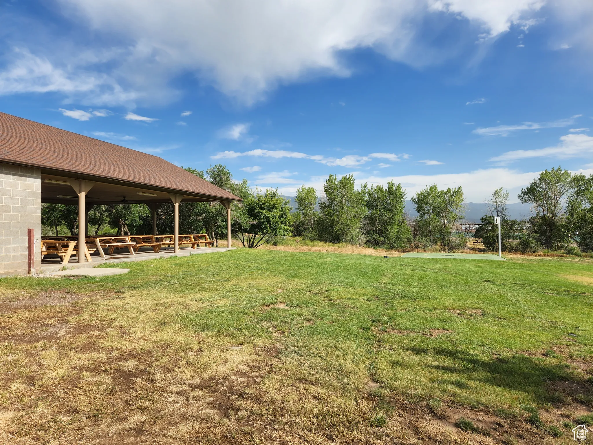 View of green lawn with a gazebo