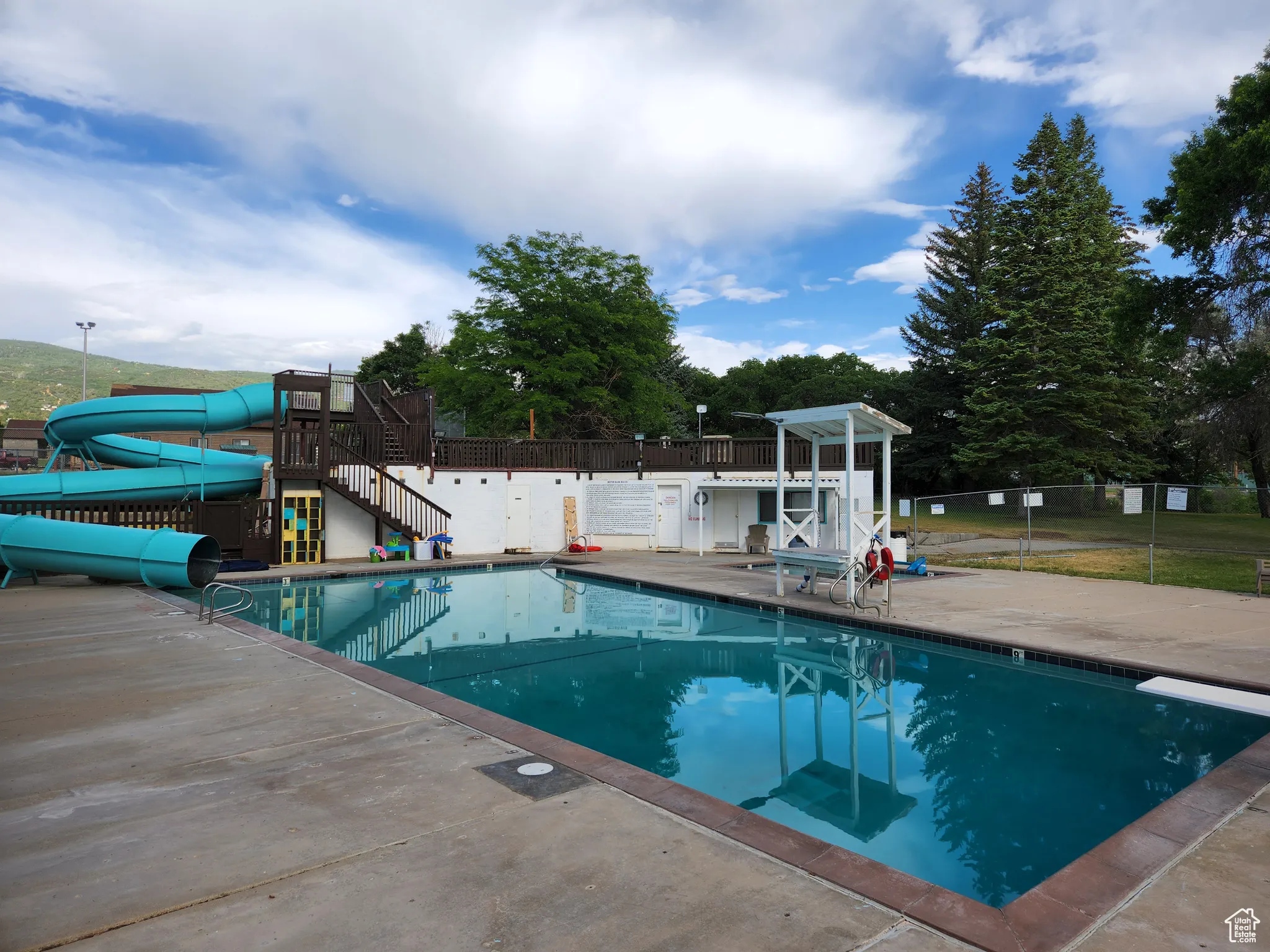 Community pool with a water slide