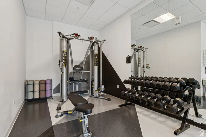 Exercise room featuring a drop ceiling