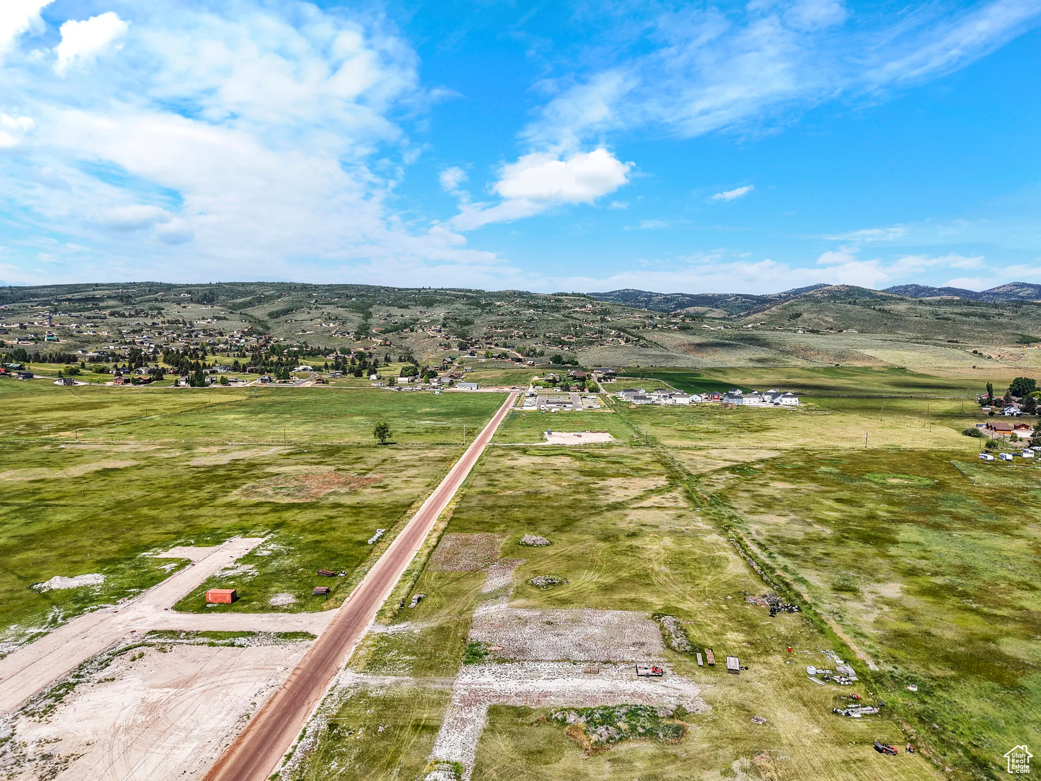Aerial view of sparsely populated area with a mountainous background