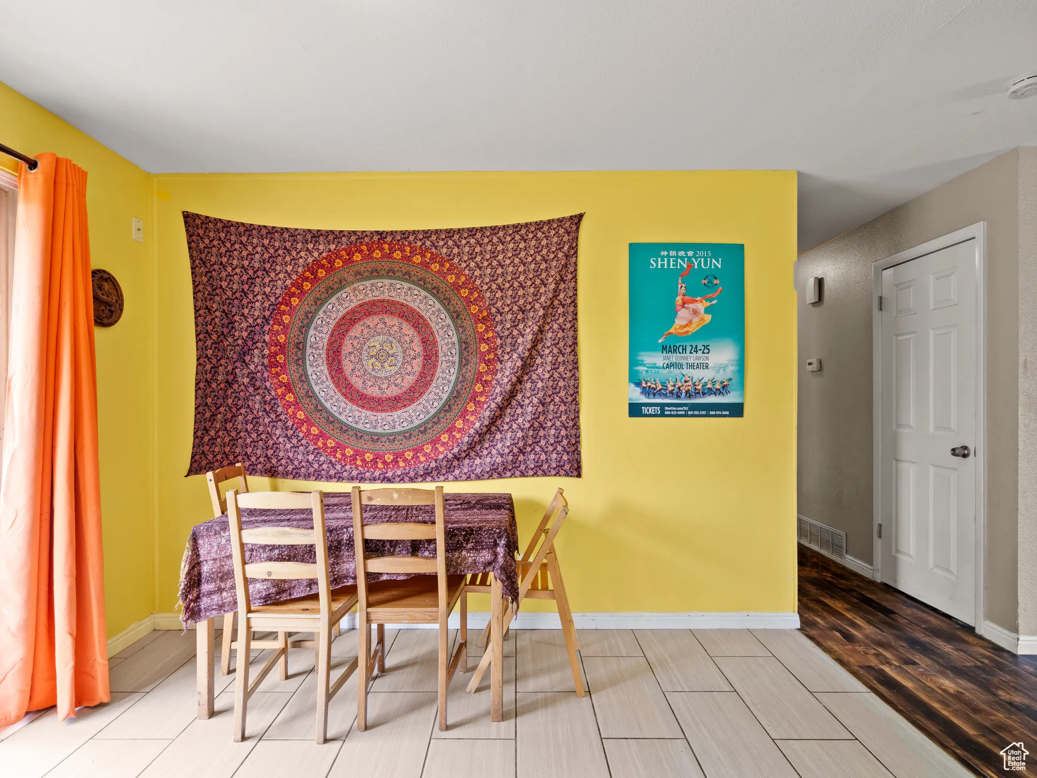 Dining room featuring light wood-type flooring and baseboards
