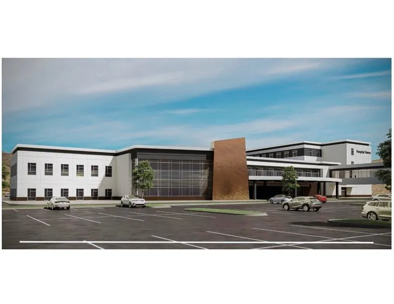 View of building exterior with uncovered parking