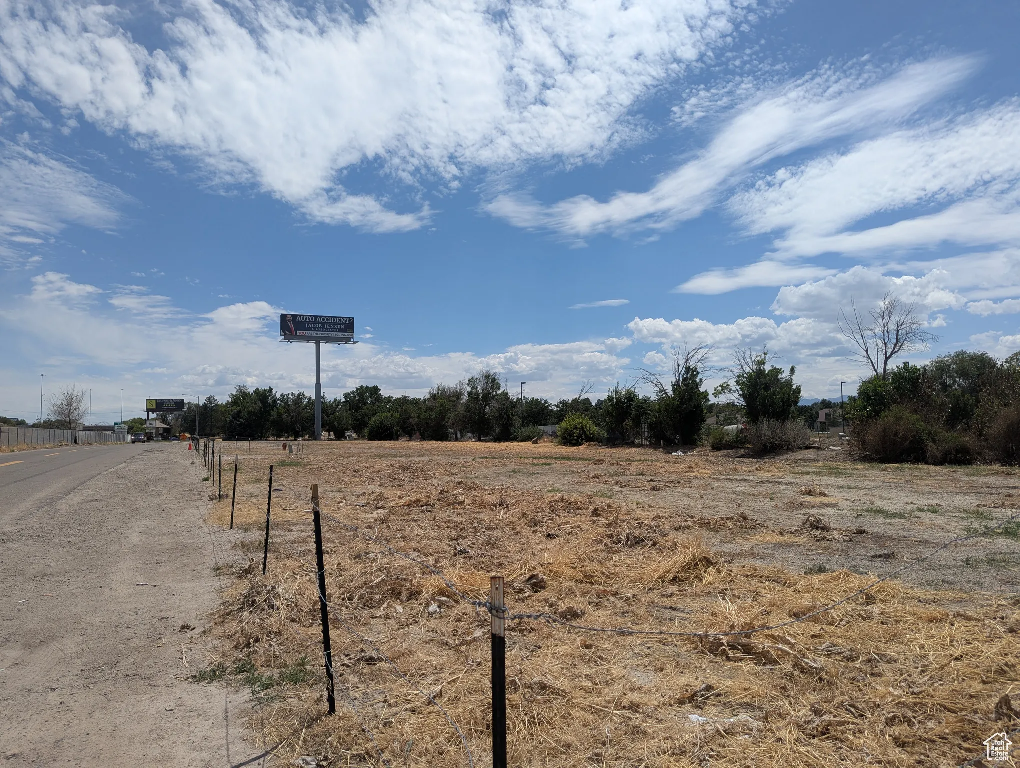 View of asphalt street with a view of countryside