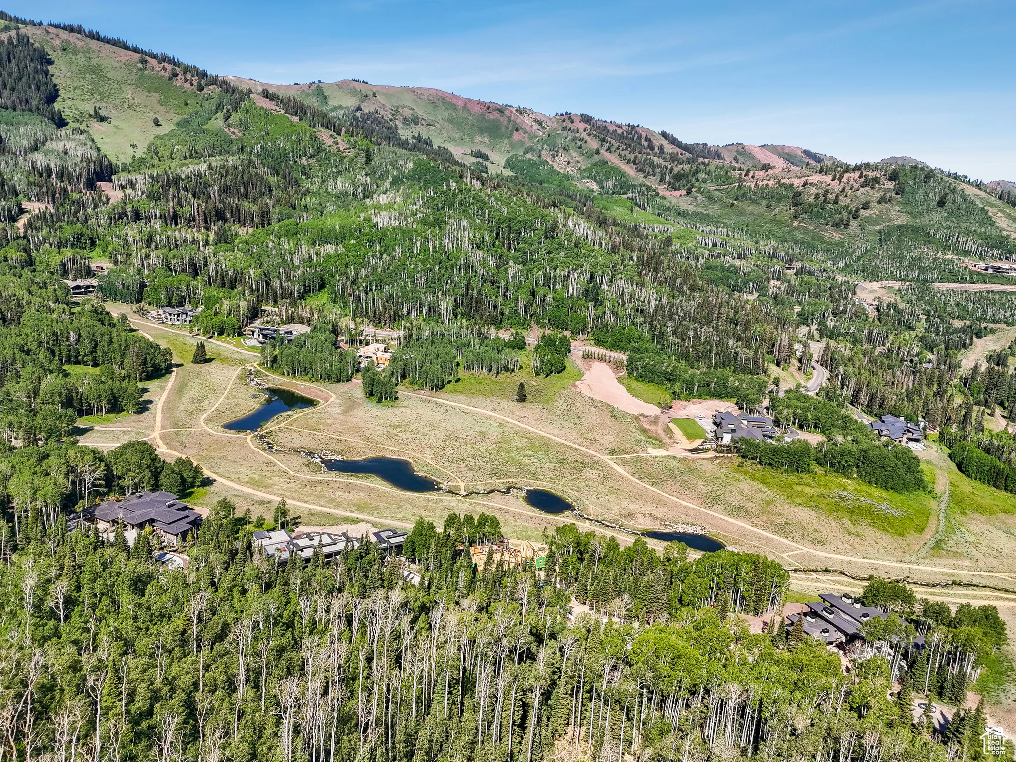 Aerial overview of property's location with a mountain backdrop