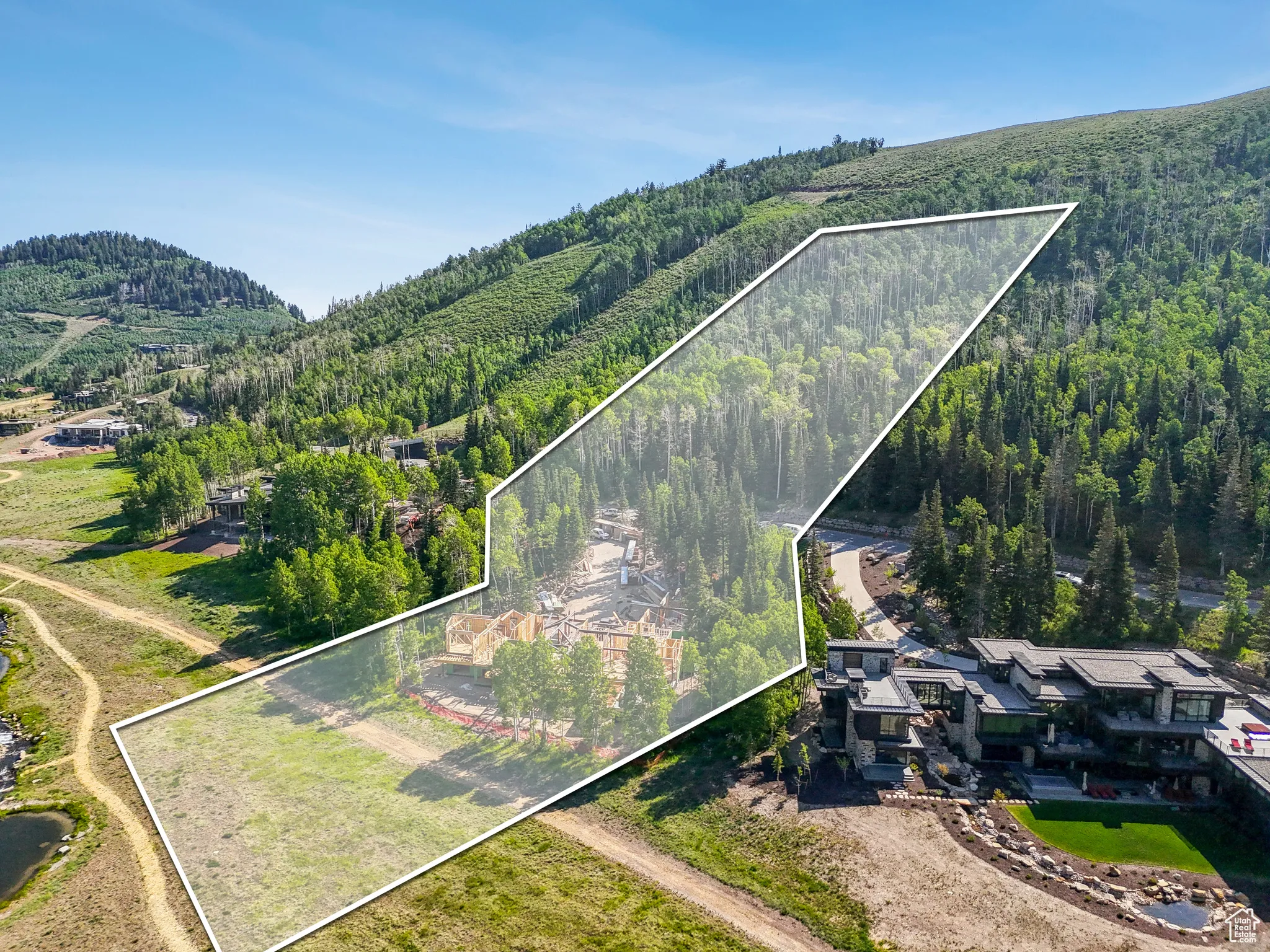 View of property location with a heavily wooded area and property boundaries highlighted