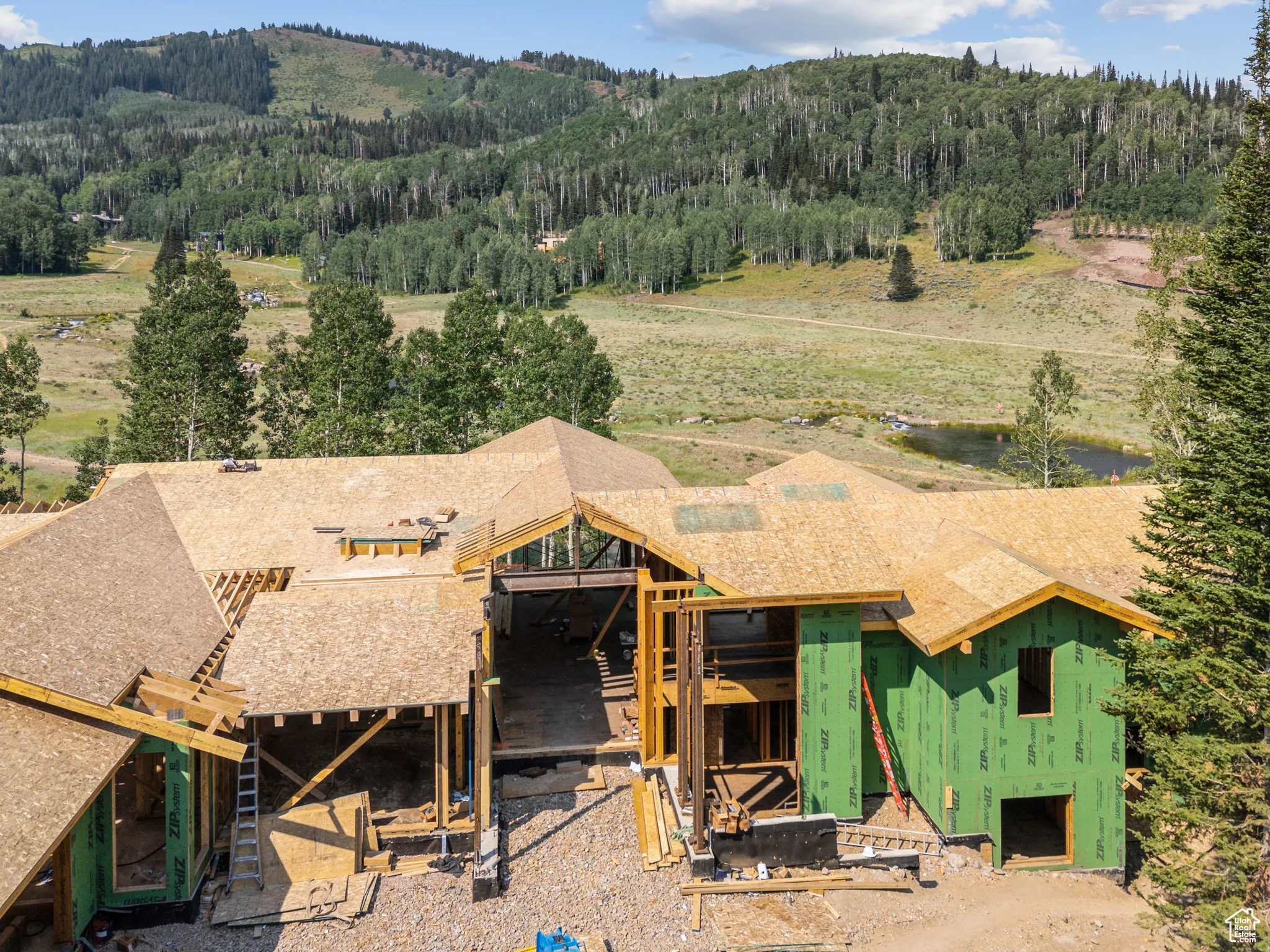 View from above of property with a forest