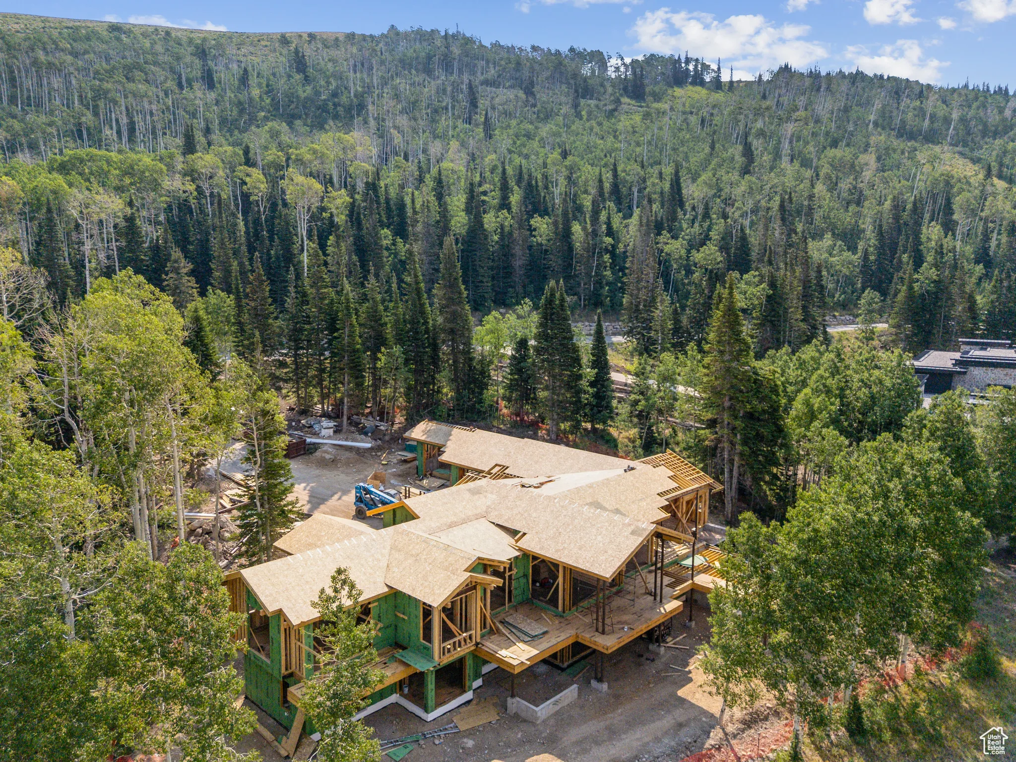 View from above of property with a forest