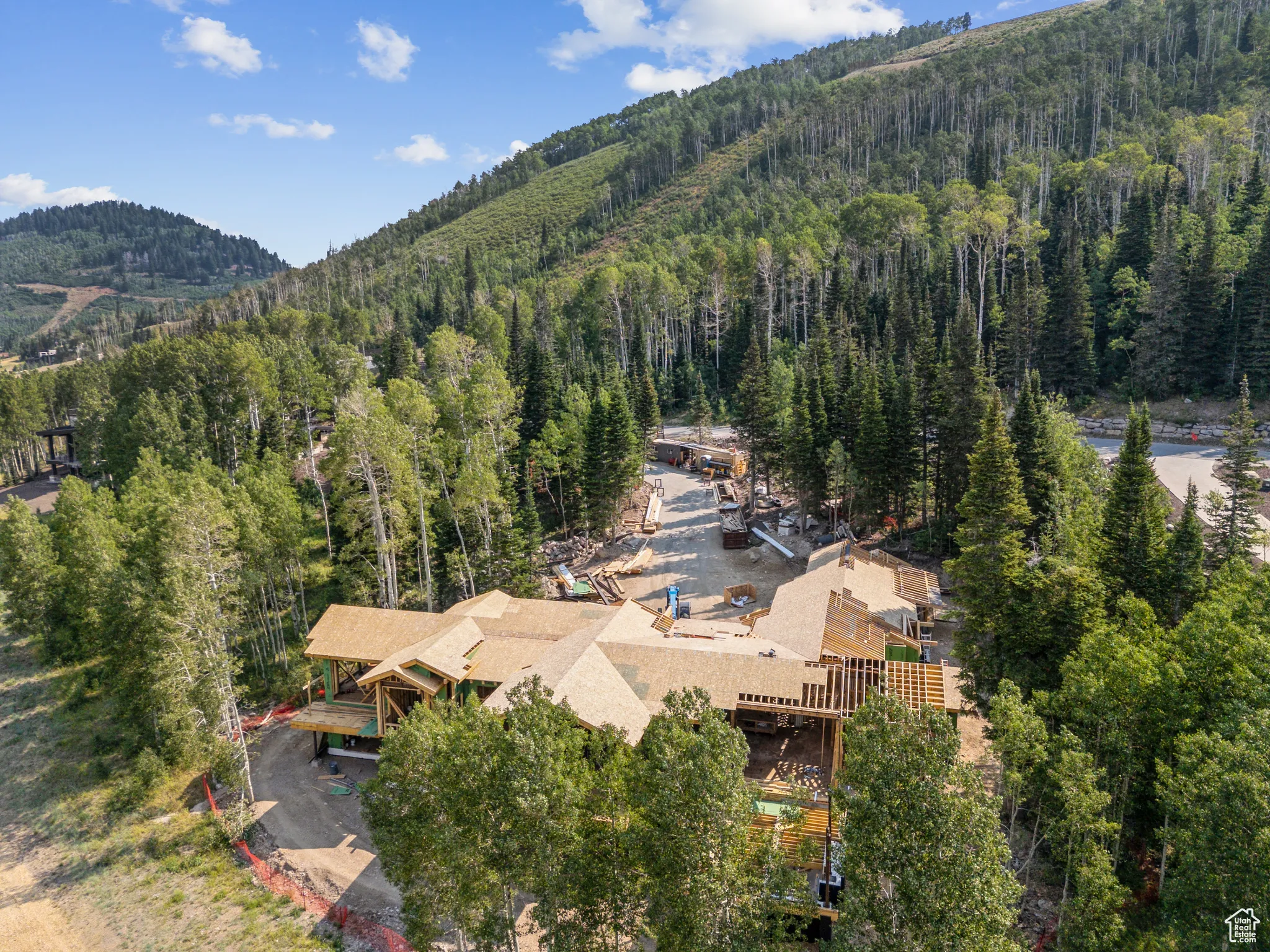 View from above of property with a mountain backdrop