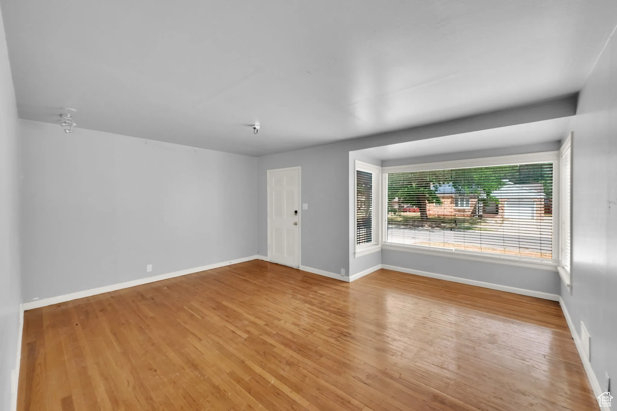 Unfurnished room featuring wood finished floors
