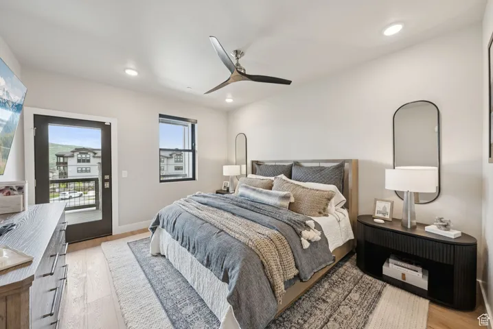 Bedroom featuring light wood-style floors, access to exterior, ceiling fan, and recessed lighting
