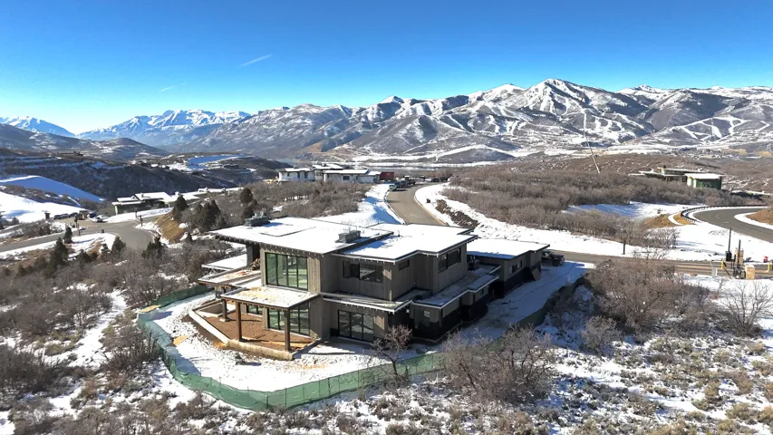 Snowy aerial view featuring a mountain view