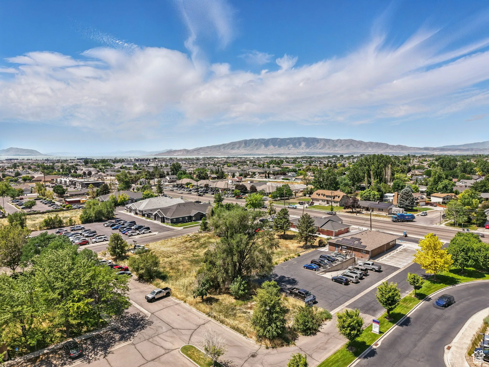 Aerial perspective of suburban area featuring a mountainous background