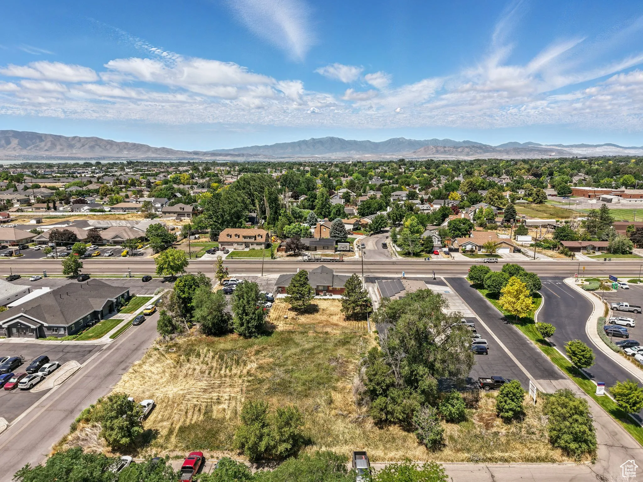 Aerial perspective of suburban area with a mountainous background