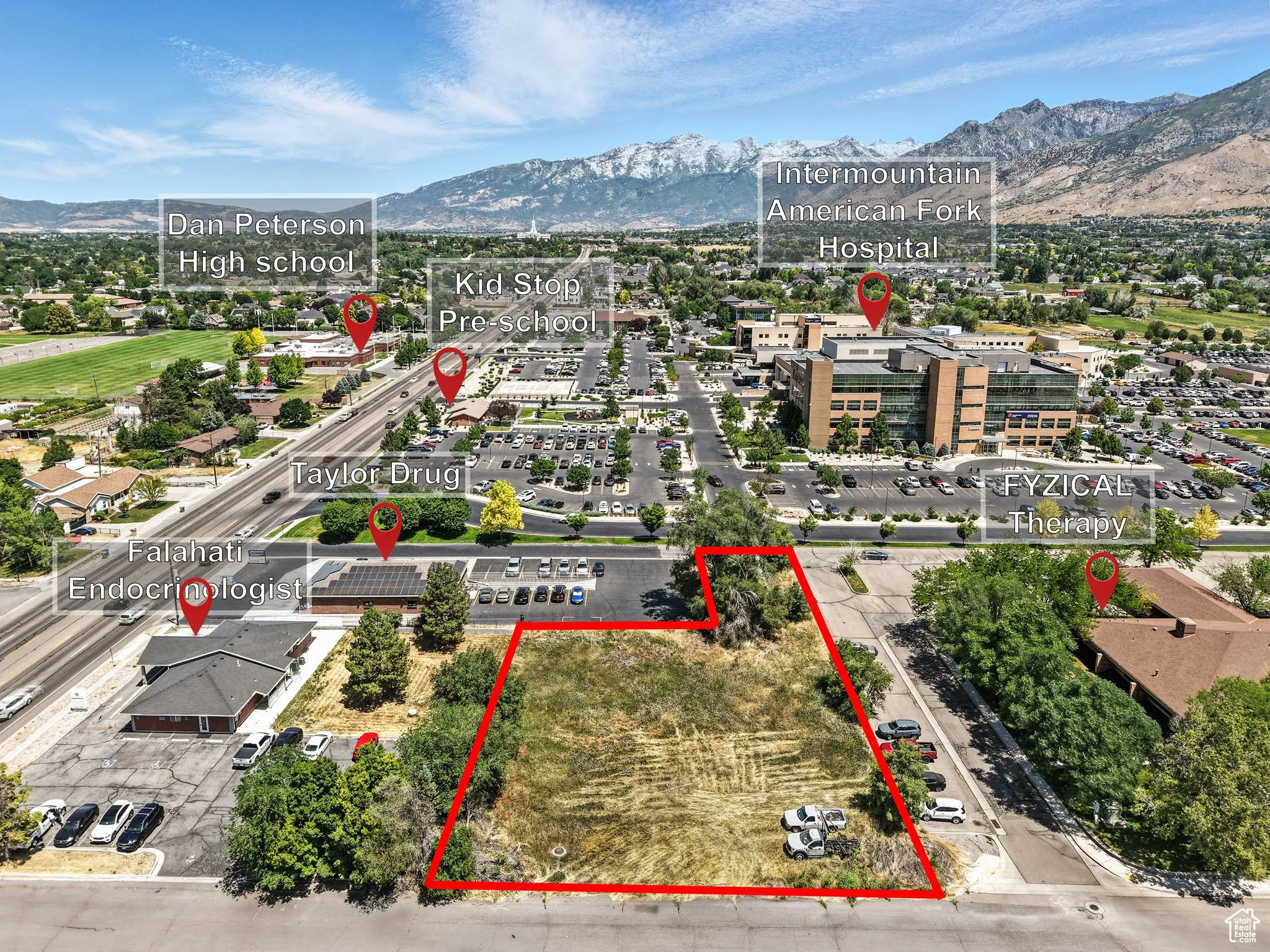 View of property location with a mountainous background and property boundaries highlighted