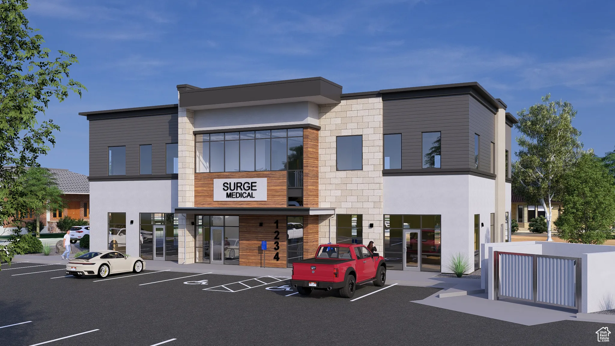 View of building exterior featuring uncovered parking