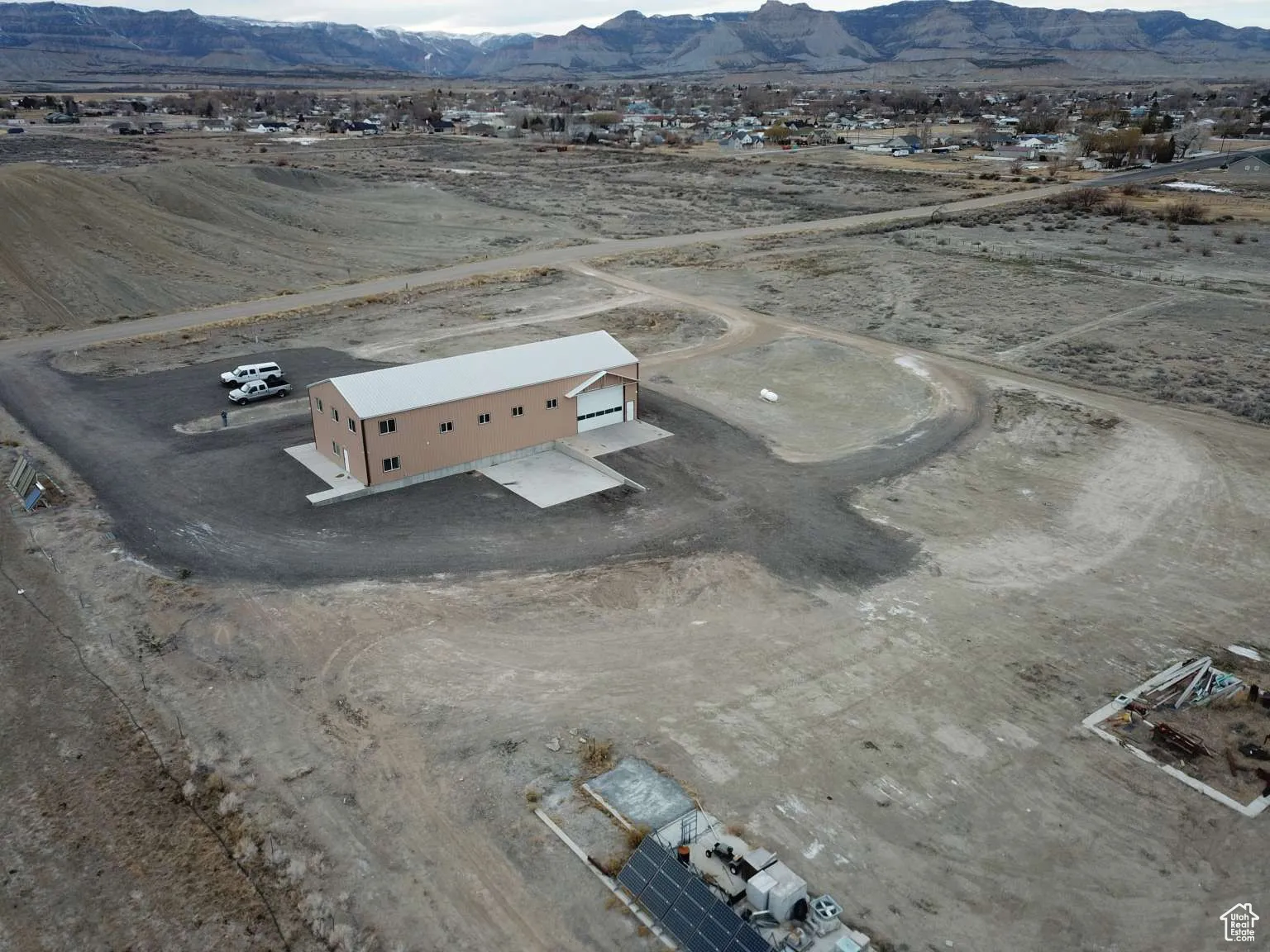 View of rural area featuring mountains and a desert landscape