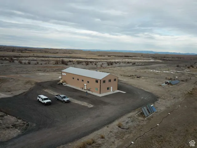 Overview of rural landscape with a desert landscape and a mountain backdrop