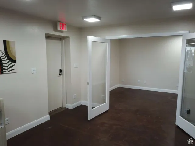 Unfurnished room with baseboards