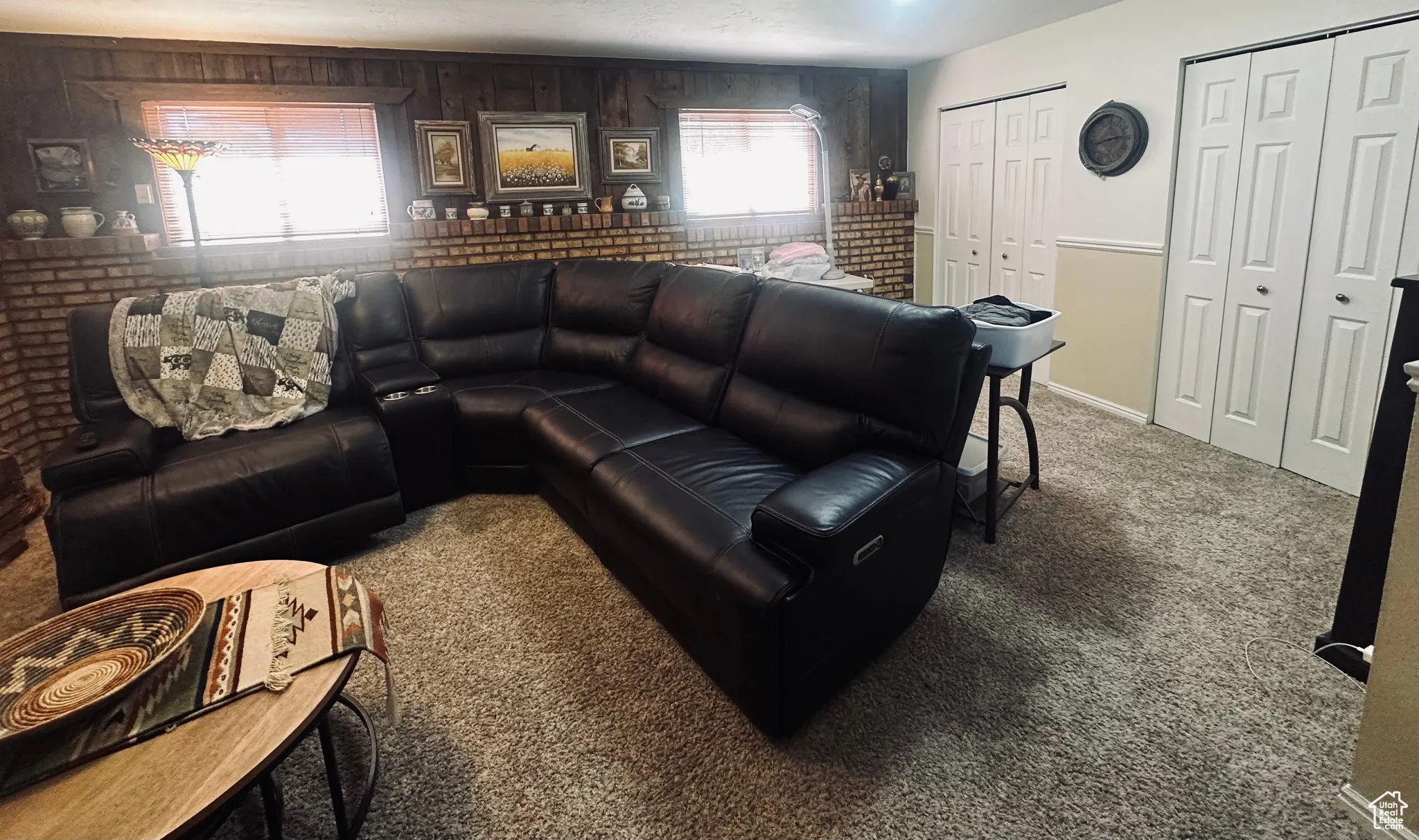 Living room featuring carpet flooring and baseboards