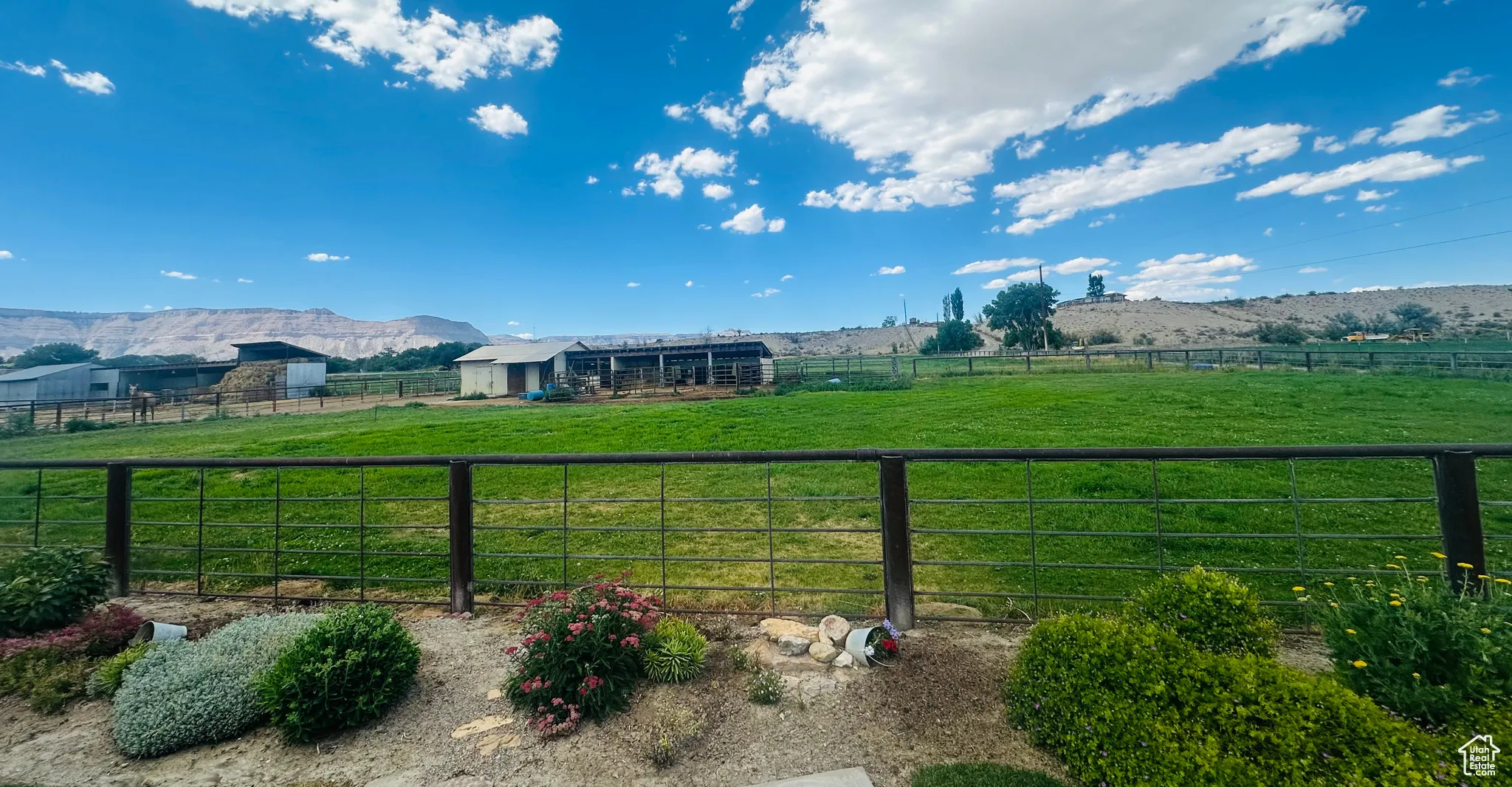 View of yard with a view of countryside, a mountain view, and an outdoor structure
