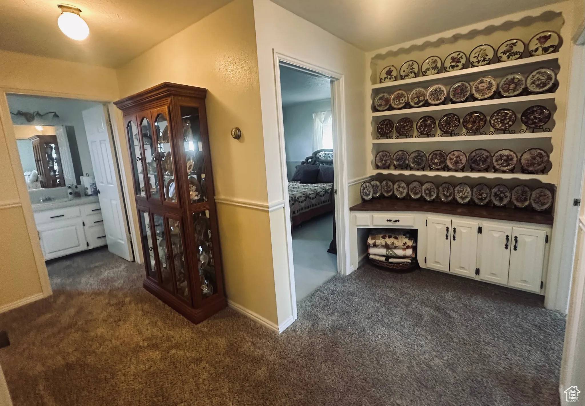 Hall with dark colored carpet