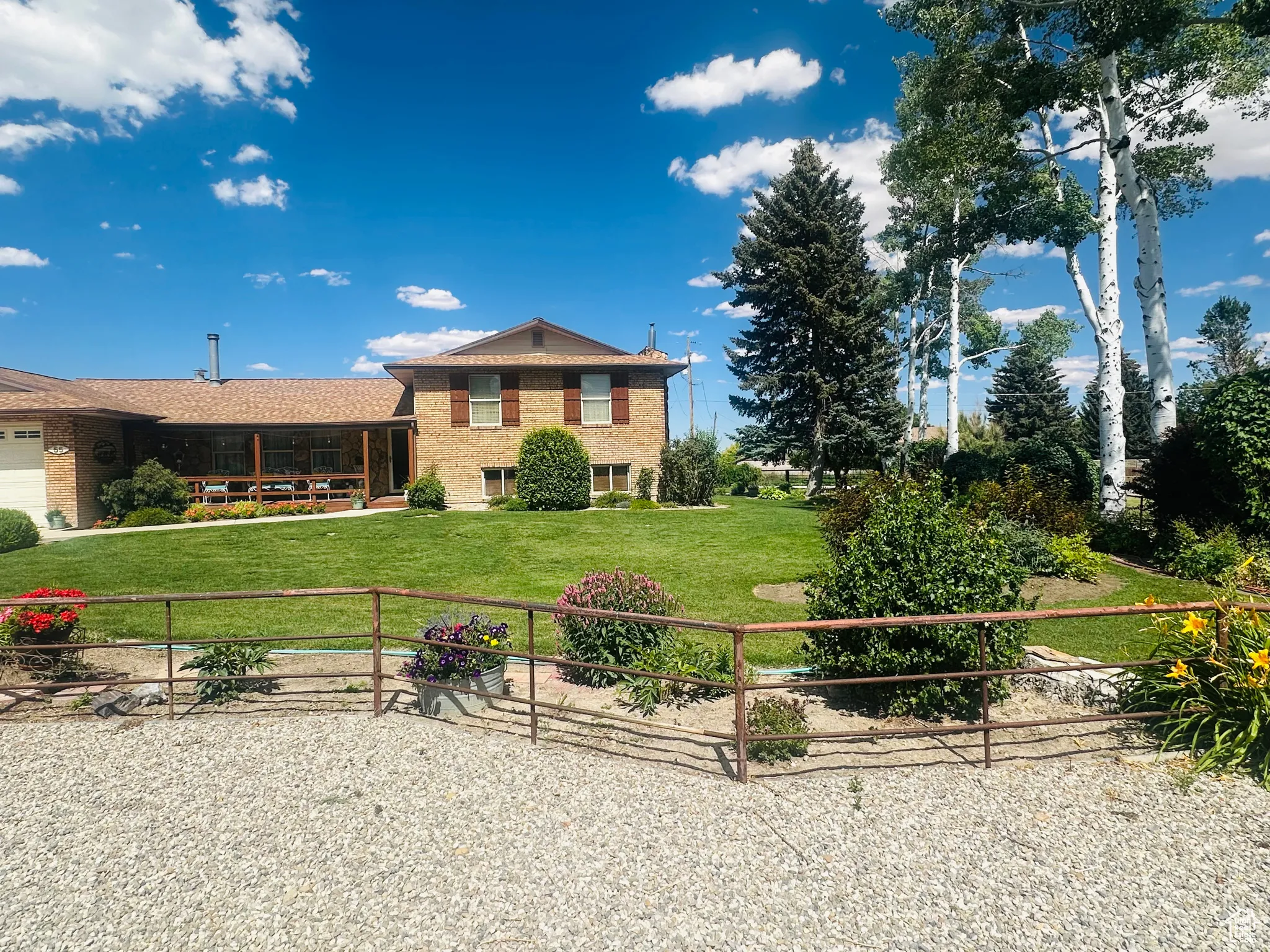 Tri-level home featuring brick siding