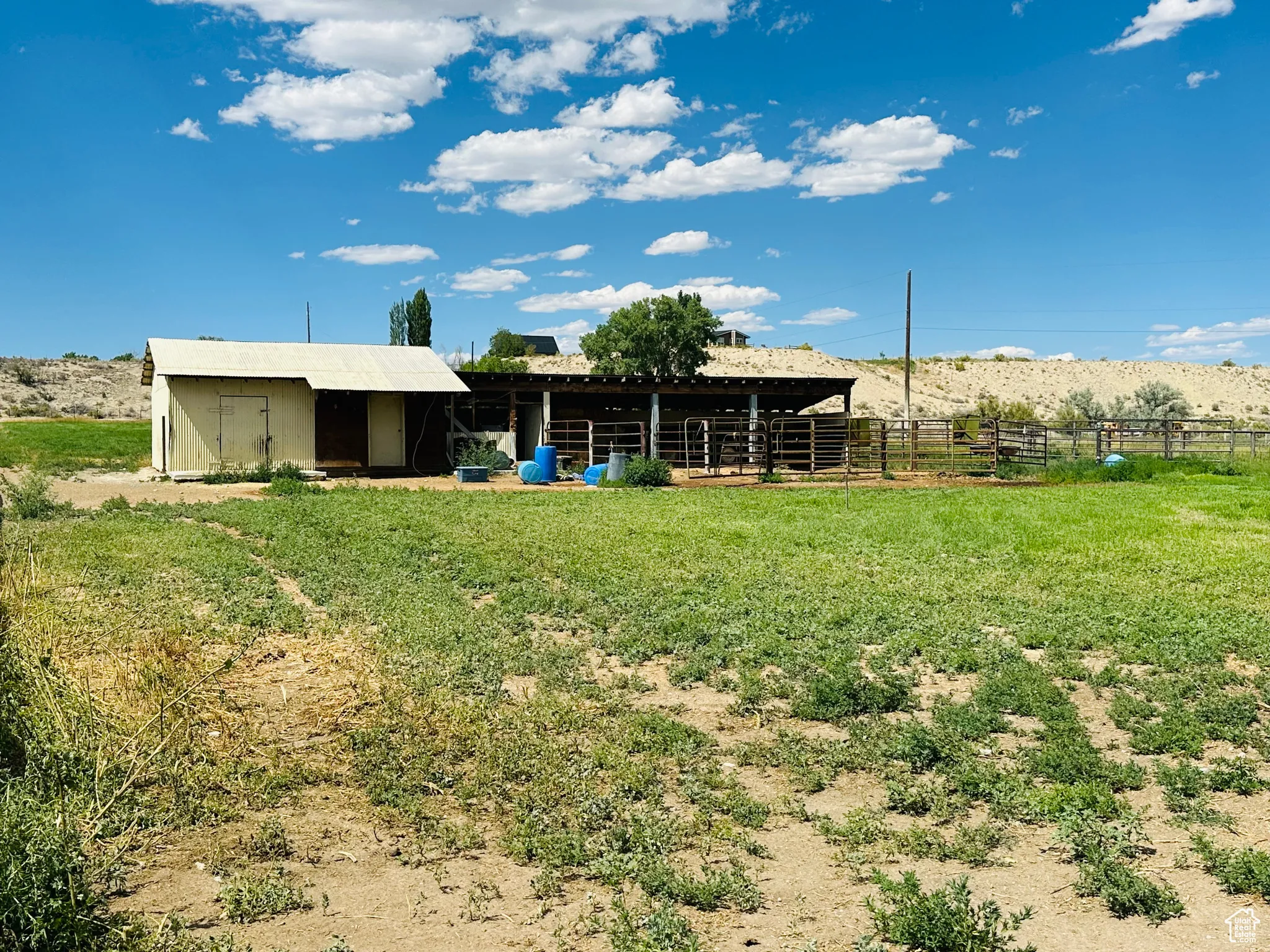 View of yard with an outdoor structure, an exterior structure, and a view of rural / pastoral area