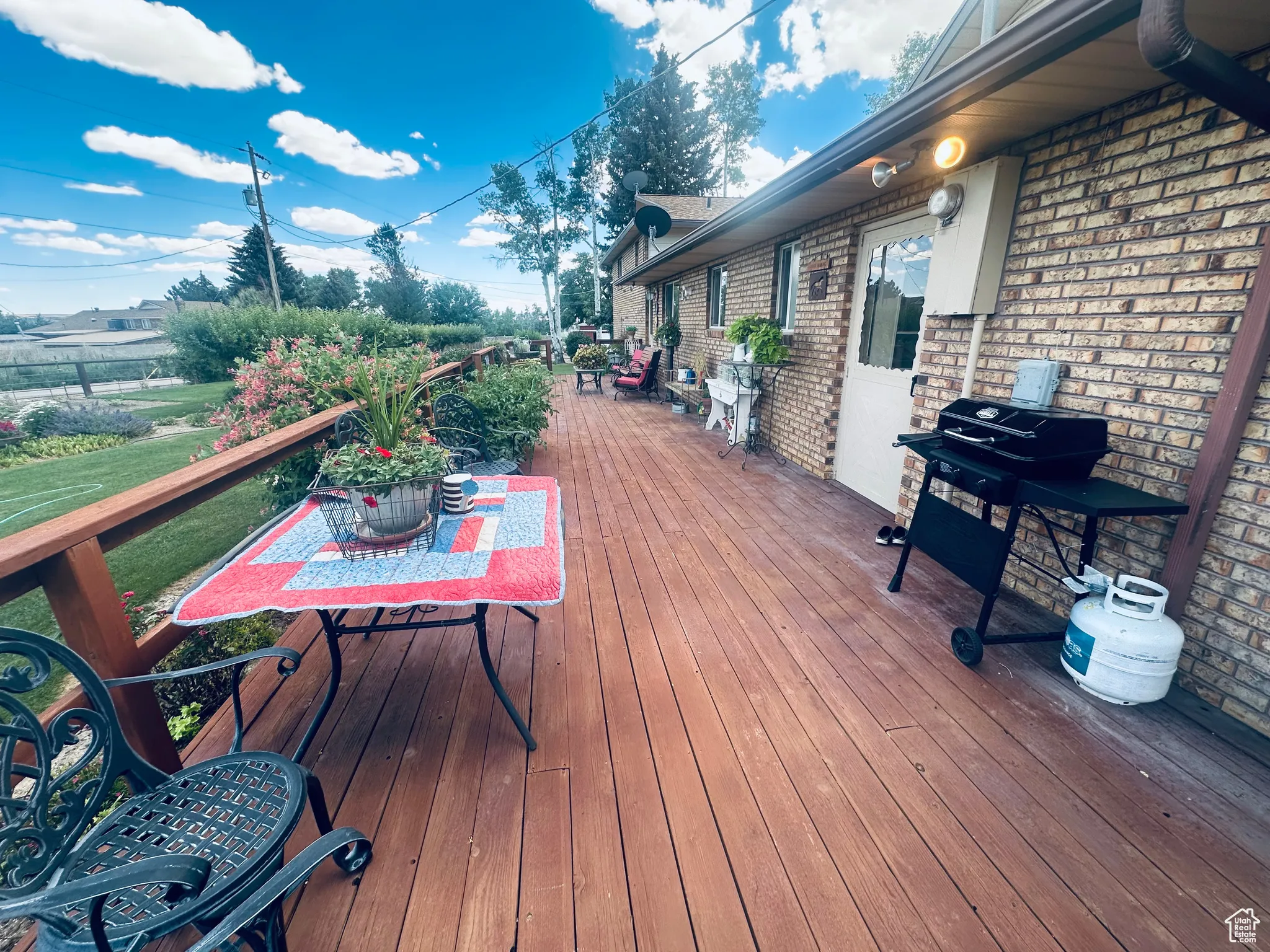 Deck featuring outdoor dining space and grilling area