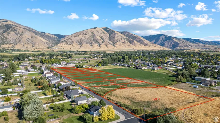 View of mountain backdrop featuring nearby suburban area