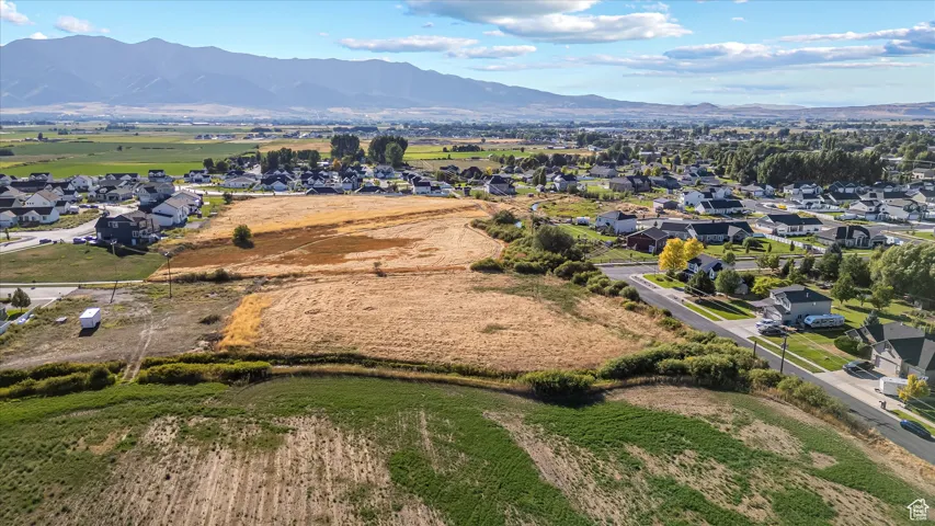Aerial view of residential area featuring mountains