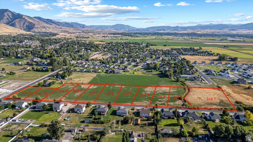 Aerial view of property's location featuring property parcel outlined and a mountain backdrop
