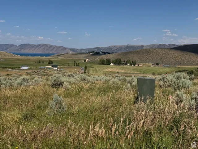 View of mountain background featuring rural landscape