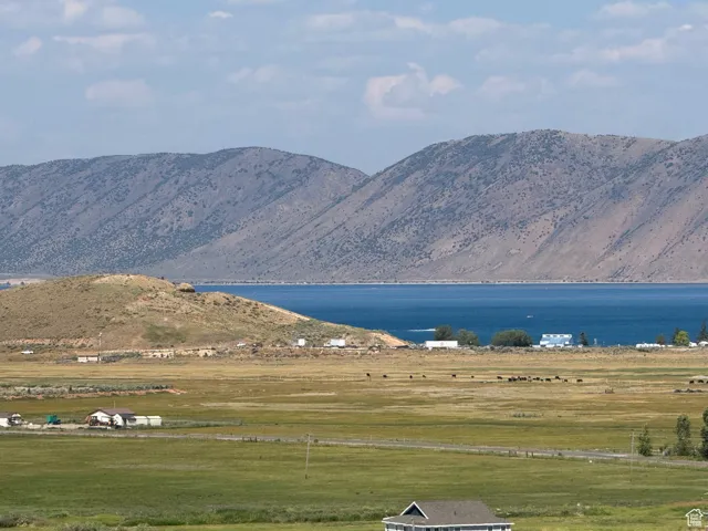 View of mountain backdrop featuring a large body of water