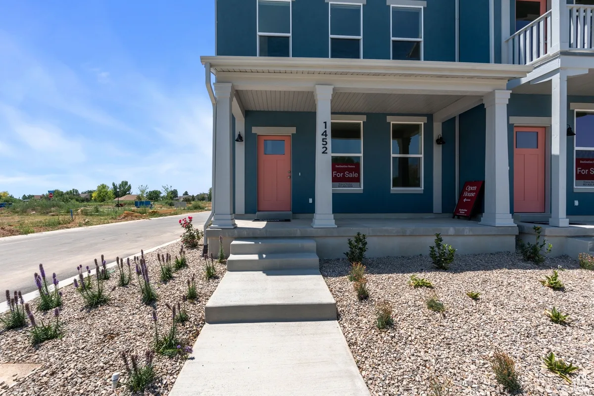 Entrance to property featuring a porch