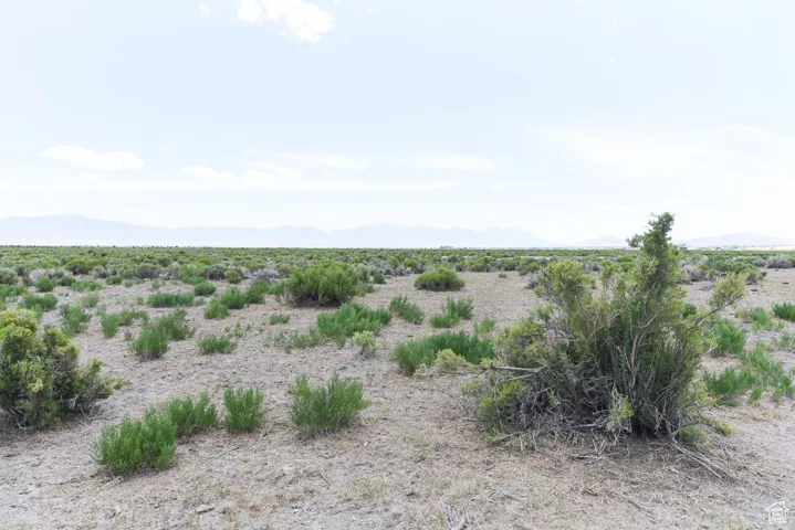 View of undeveloped land with mountains and rural landscape