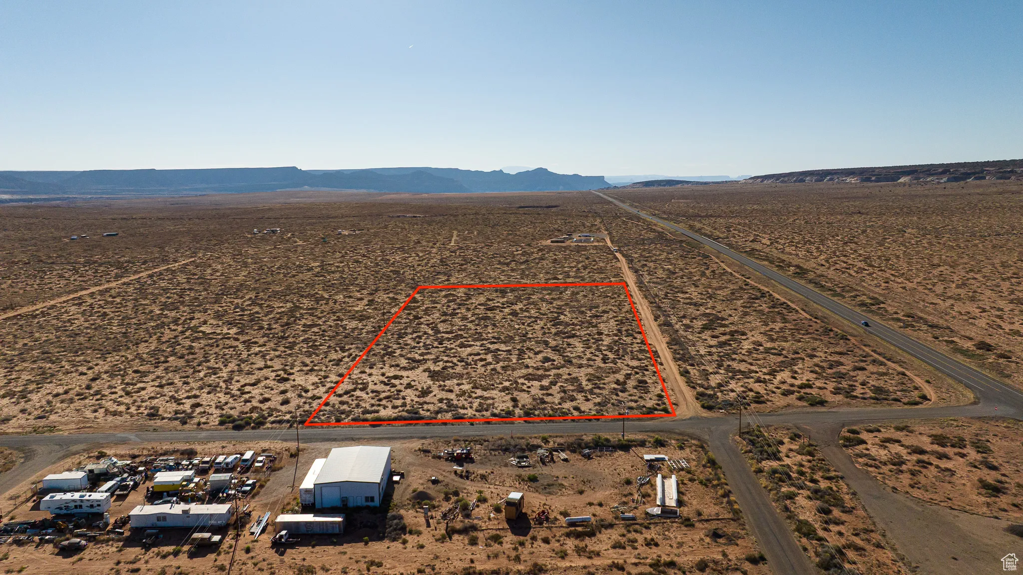 Overview of commercial property featuring mountains and property boundaries highlighted