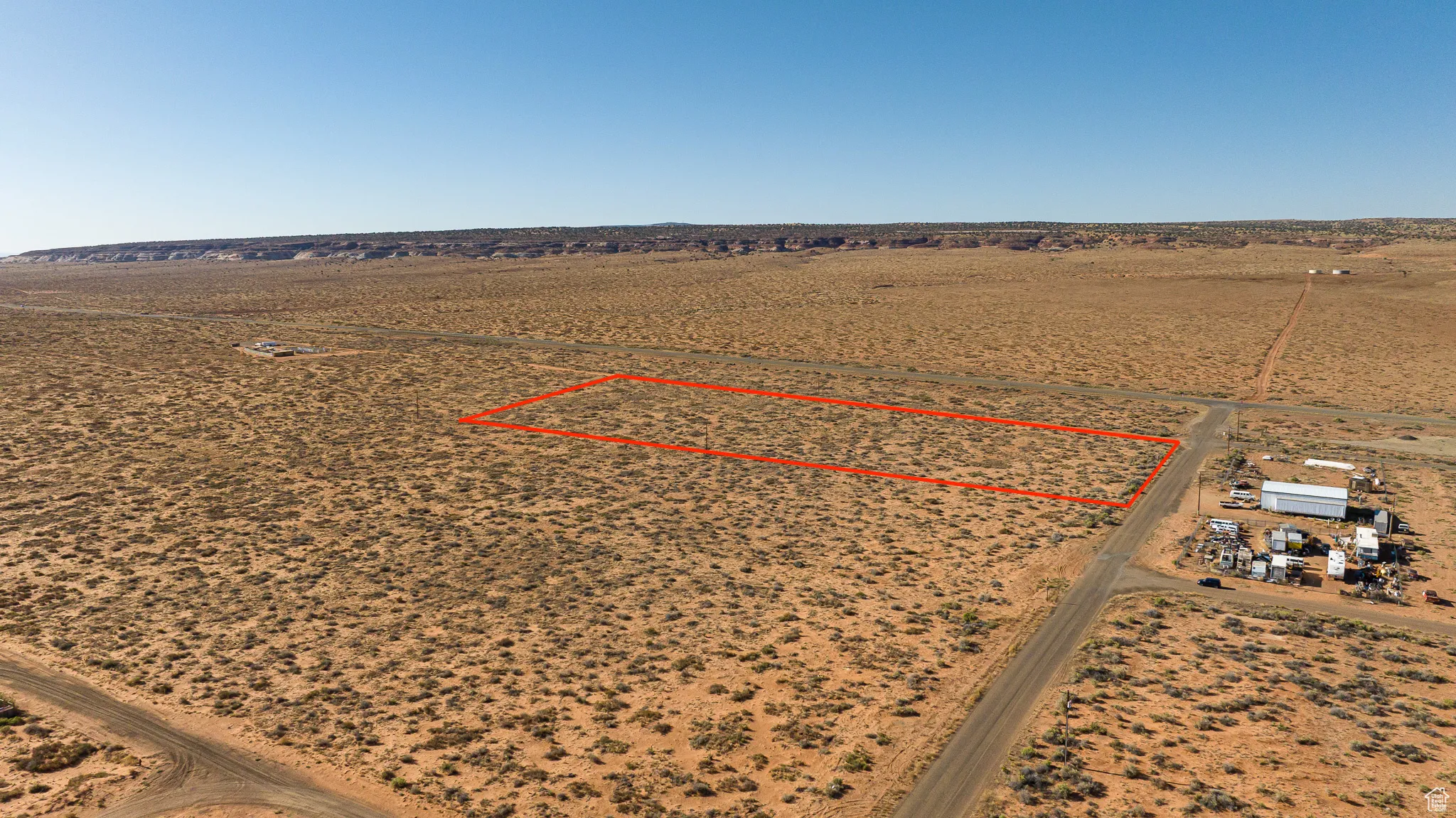 Overview of commercial property featuring mountains and property boundaries highlighted