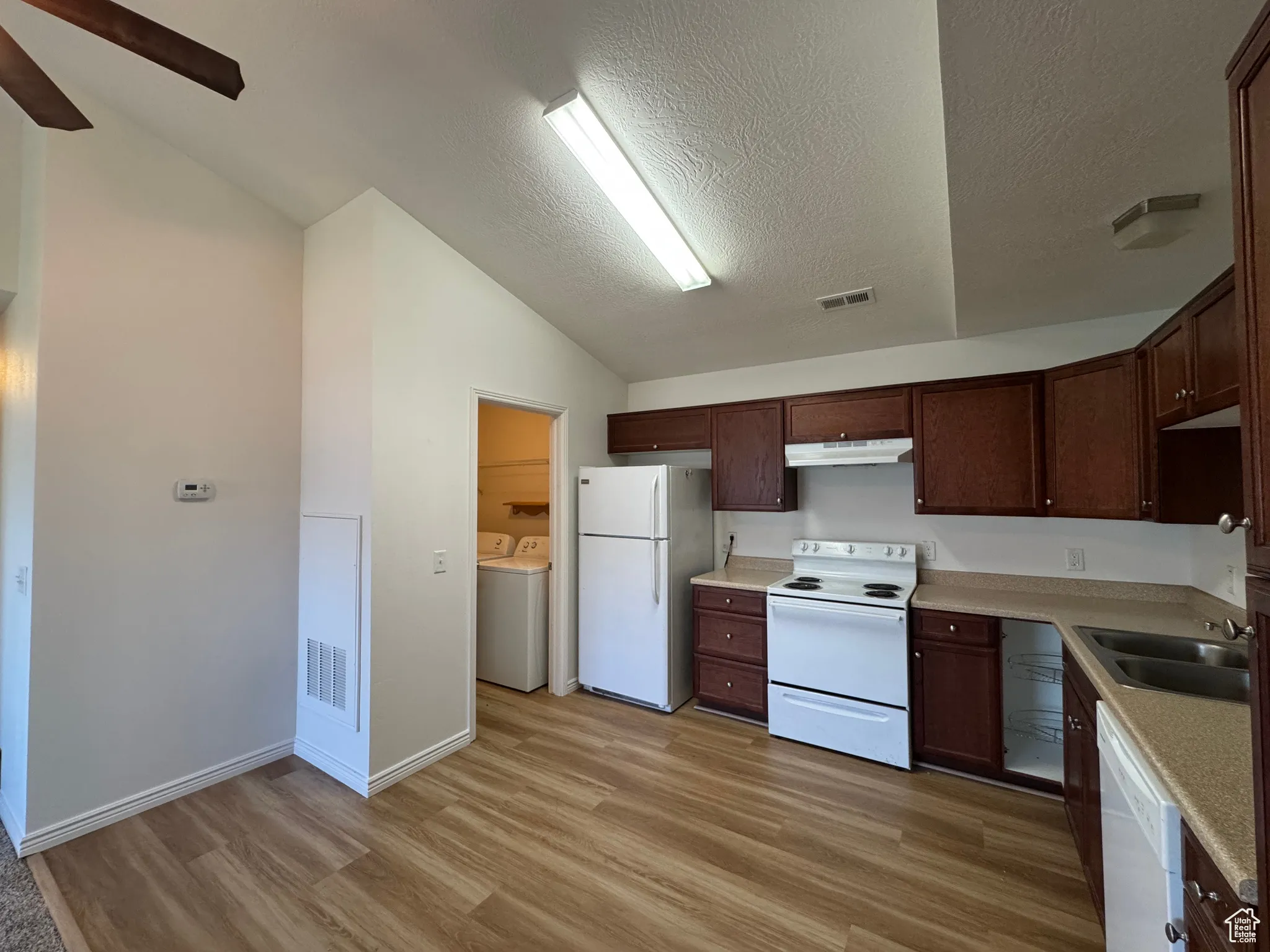 Kitchen & Laundry with New LVP and Vaulted Ceiling