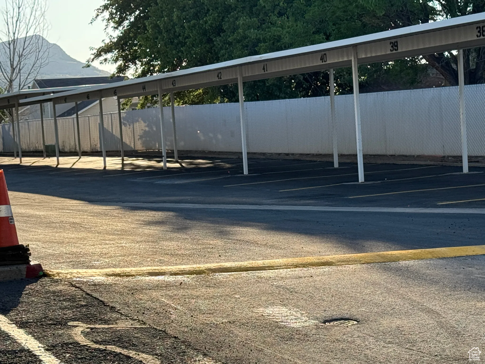 New Asphalt & Covered parking.  One spot assigned to the Condominium