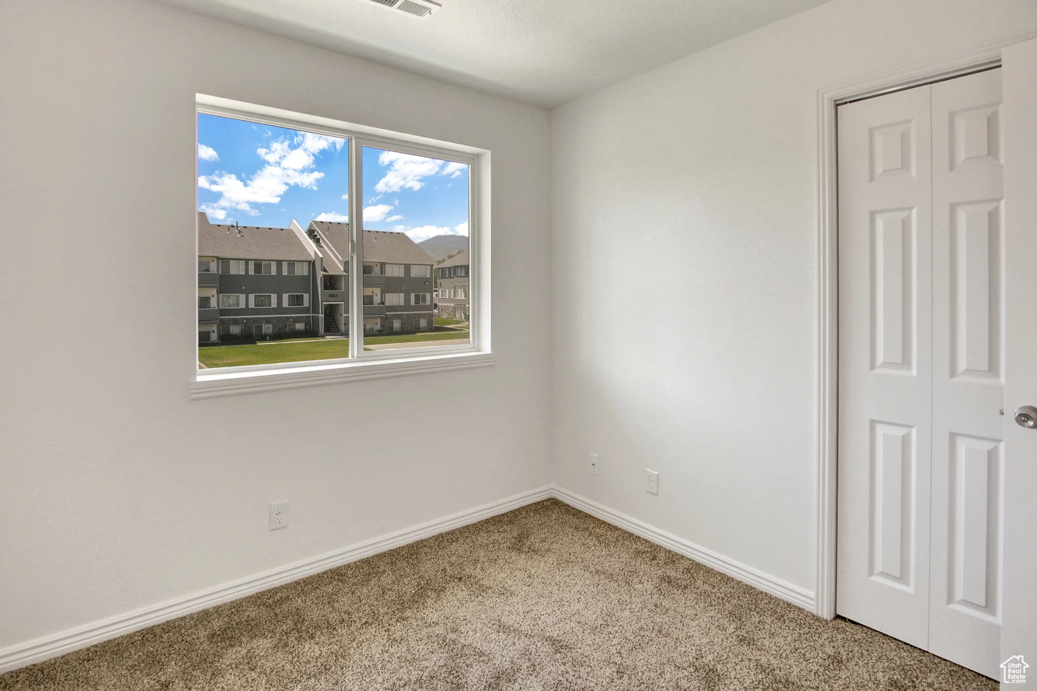 Second Bedroom with new paint & new carpet