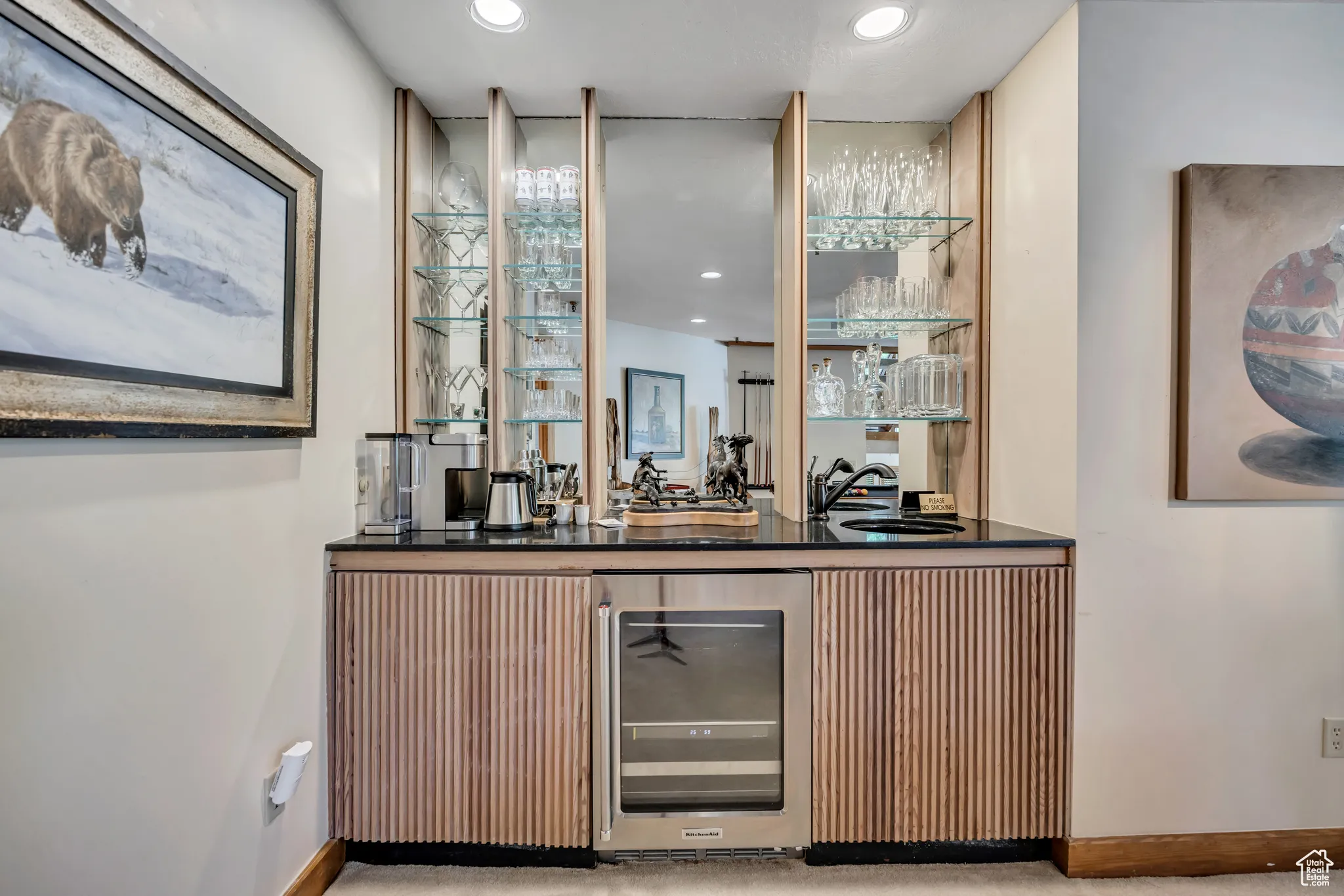 Indoor wet bar featuring wine cooler and recessed lighting