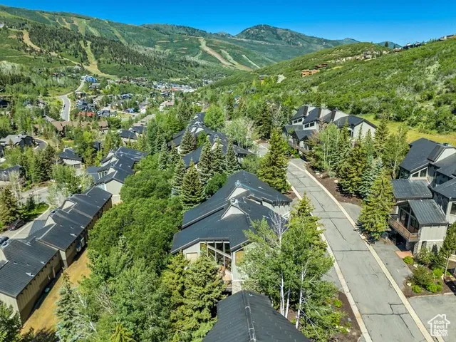 Aerial view of residential area featuring mountains