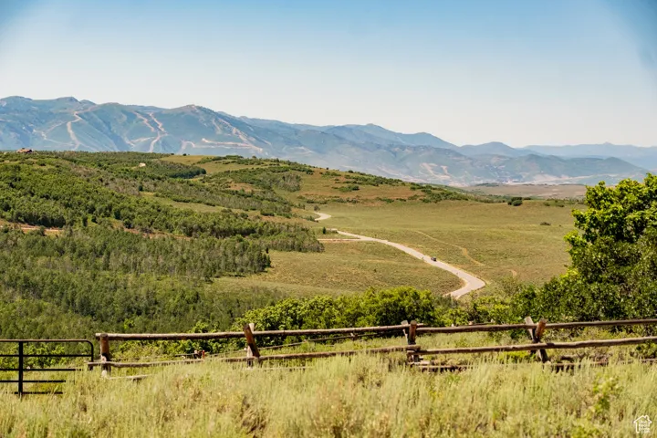 View of mountain backdrop with rural landscape